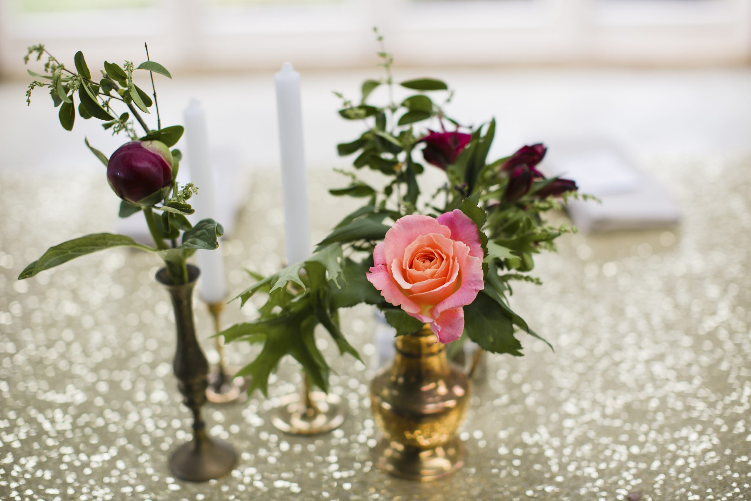gold sequin table runner and vintage vases