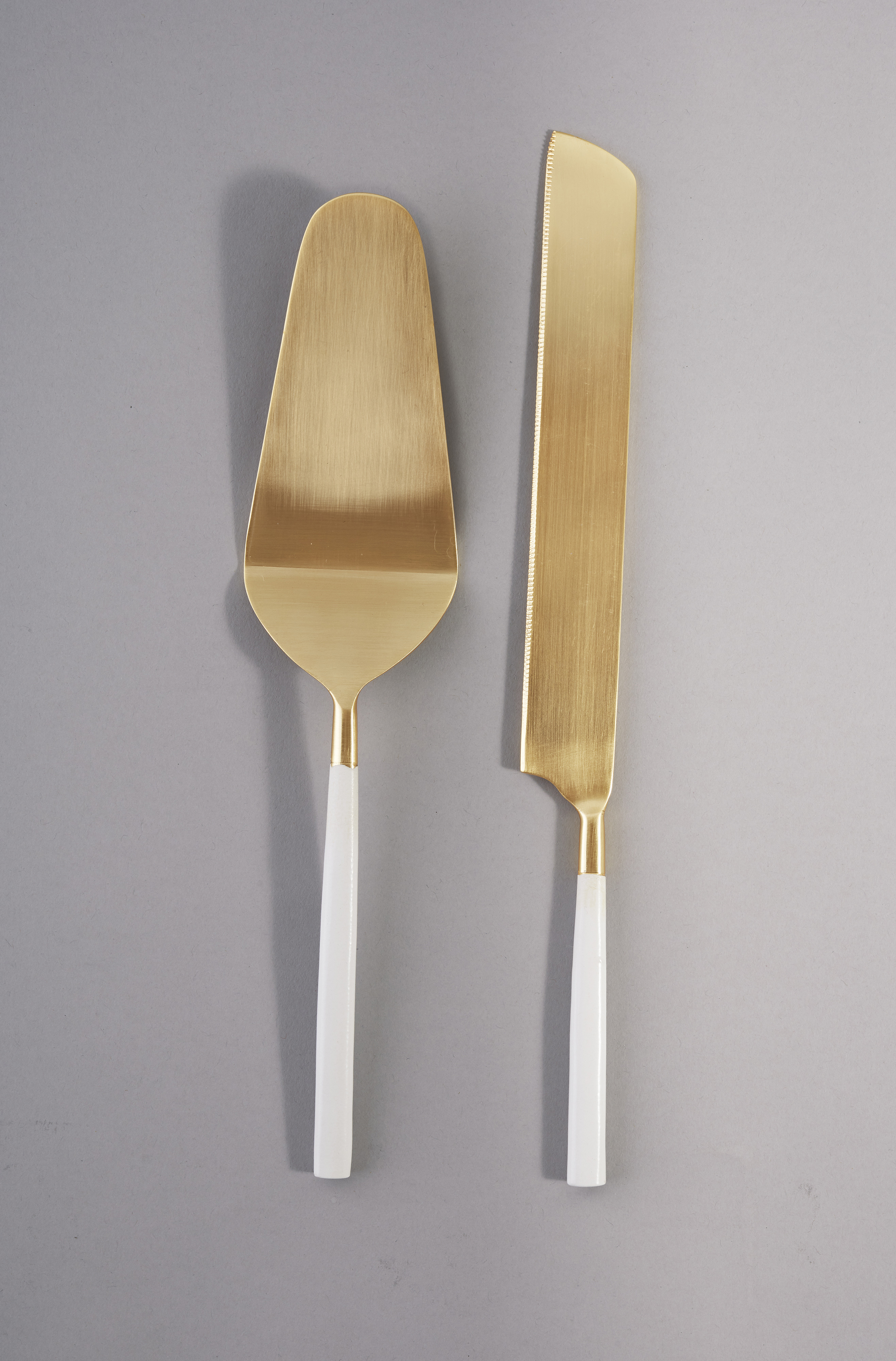 white and gold cake knife set hire nz