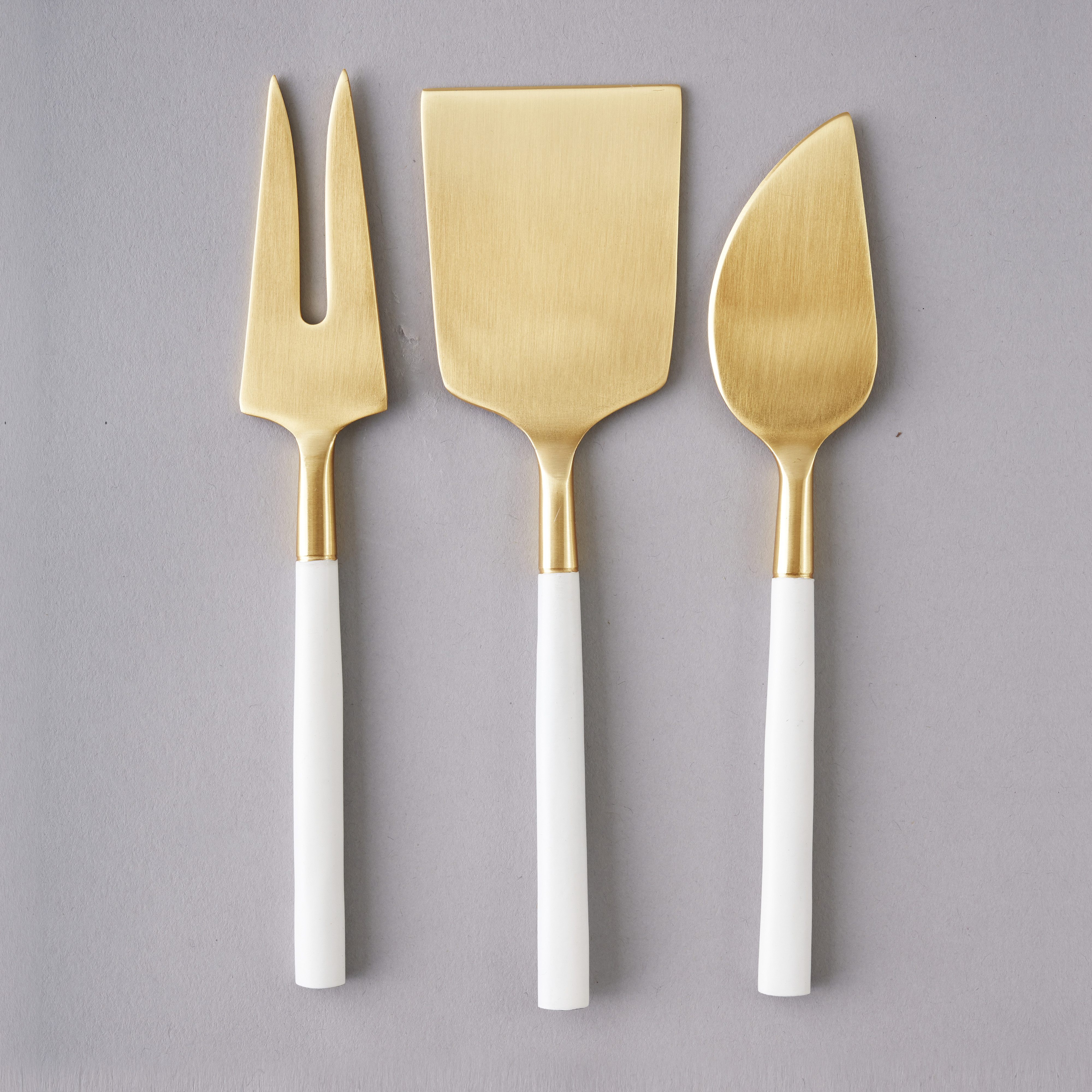 white and gold cheese knife hire nz